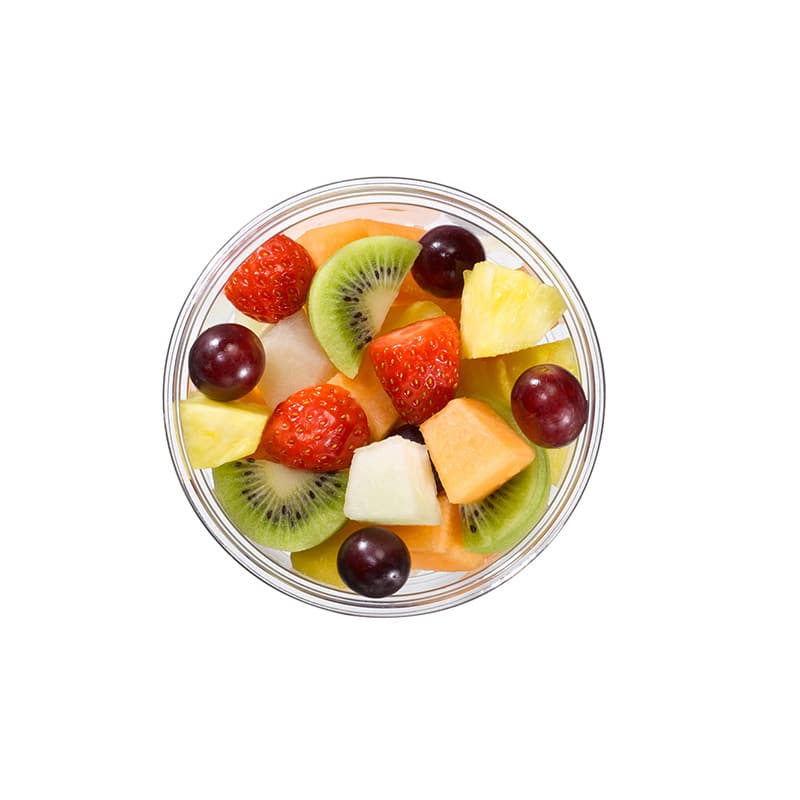 Fruitmix met aardbei, ananas, kiwi, druiven, gele meloen en Cantaloupe meloen